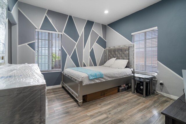 1320 W 50th St, Los Angeles, CA 90037 - bedroom with baseboards, recessed lighting, and wood finished floors