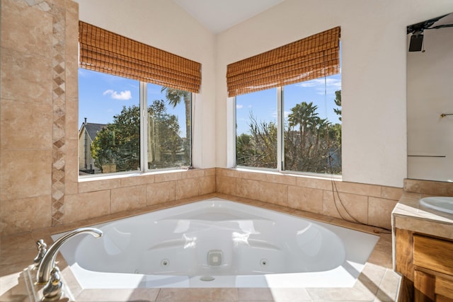 bathroom with a relaxing tiled tub and sink