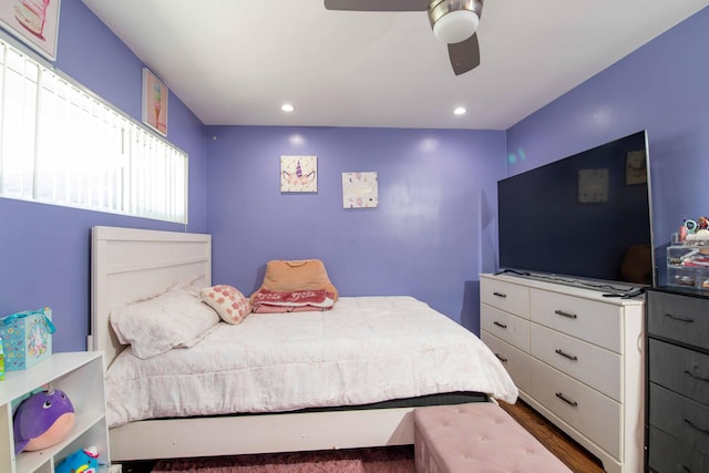 bedroom with wood finished floors, a ceiling fan, and recessed lighting