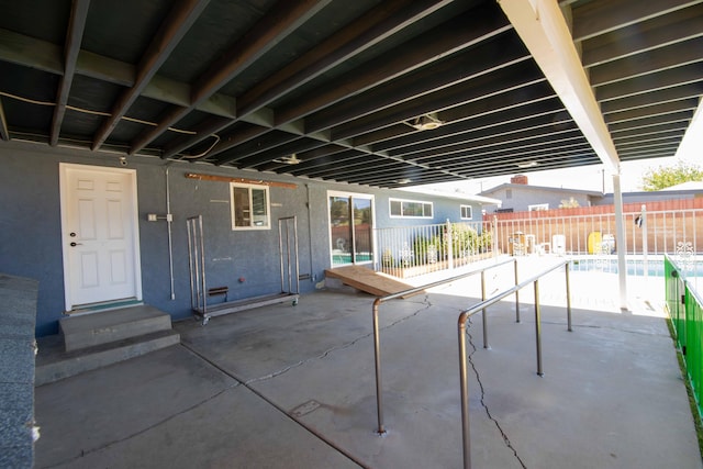 view of patio / terrace featuring fence and a fenced in pool