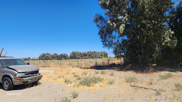 view of yard with a rural view