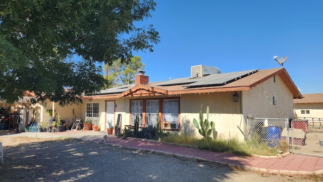 single story home with solar panels