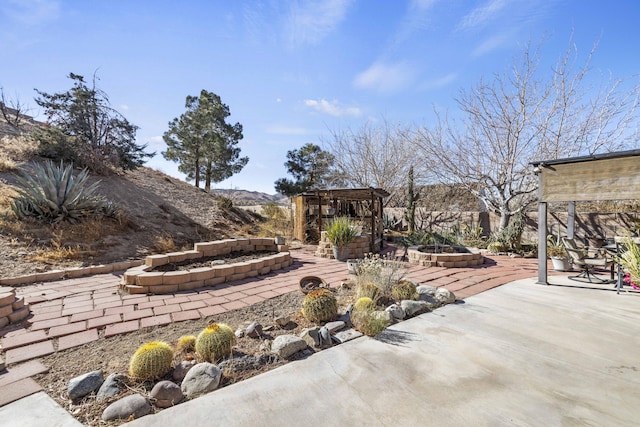 view of patio featuring an outdoor fire pit, a gazebo, and a mountain view