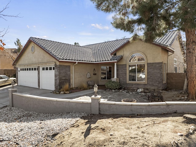 ranch-style house featuring a garage