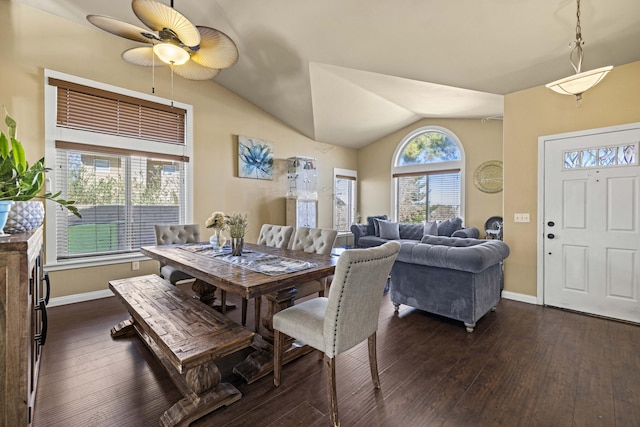 dining room featuring vaulted ceiling and dark hardwood / wood-style floors