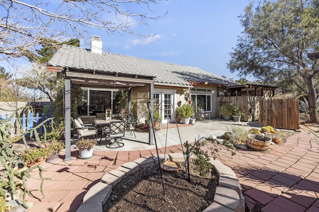 back of property featuring french doors, a patio area, and a pergola