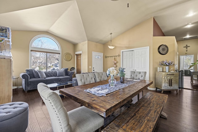 dining room with vaulted ceiling and dark hardwood / wood-style flooring