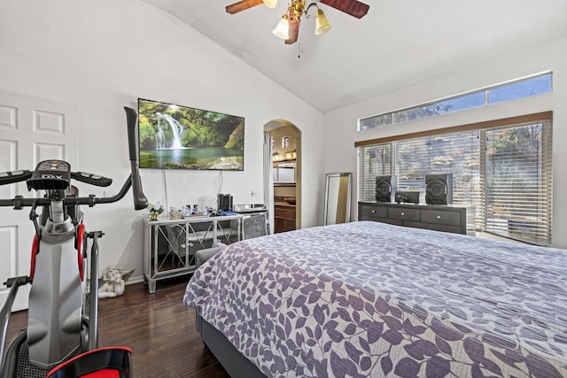 bedroom featuring dark hardwood / wood-style floors, vaulted ceiling, ceiling fan, and connected bathroom