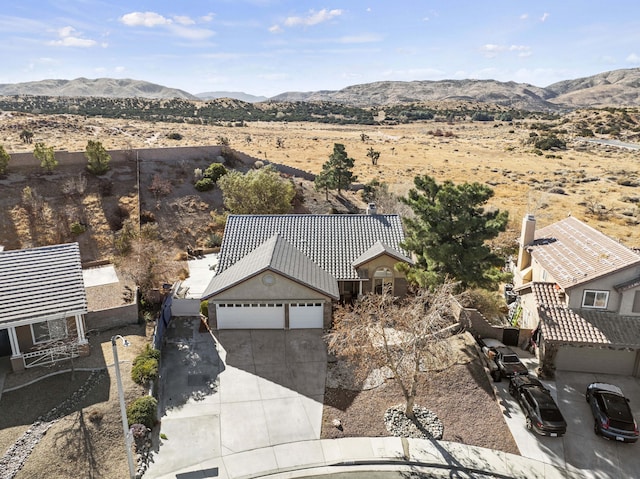 birds eye view of property featuring a mountain view