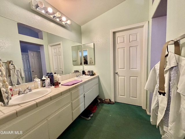 1816 Orange St, Rosamond, CA 93560 - bathroom featuring vaulted ceiling and double vanity