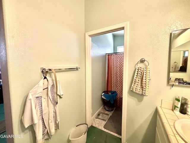 1816 Orange St, Rosamond, CA 93560 - full bathroom with vanity and a shower with shower curtain