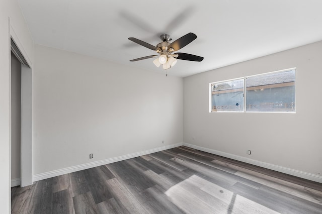 unfurnished bedroom featuring ceiling fan, baseboards, and wood finished floors