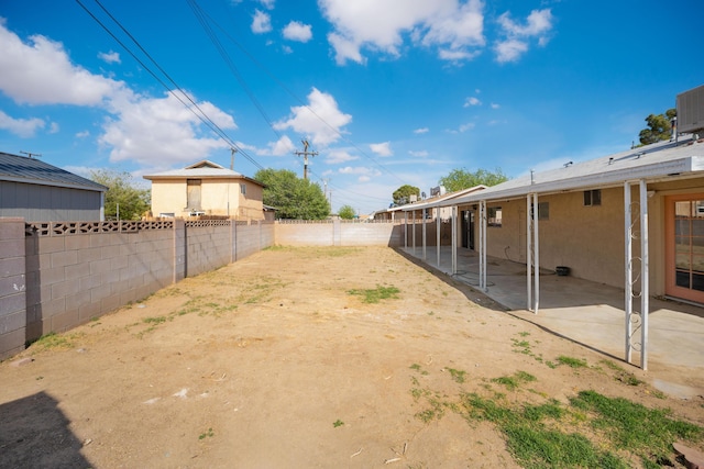 view of yard featuring a patio and a fenced backyard