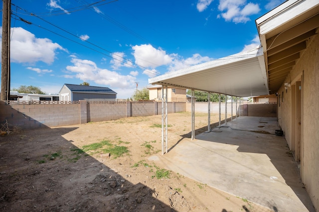 view of yard featuring a patio area and a fenced backyard
