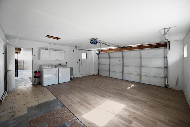 garage featuring washing machine and clothes dryer