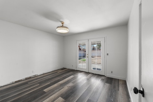 unfurnished room featuring dark wood-style floors and french doors
