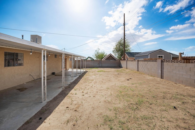 view of yard with a fenced backyard