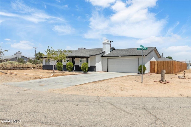 8649 Tamarack Ave, California City, CA 93505 - single story home featuring a garage, driveway, and roof with shingles