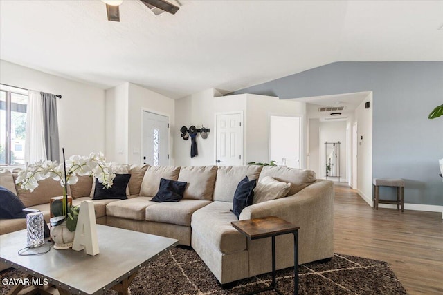 8649 Tamarack Ave, California City, CA 93505 - living area with dark wood finished floors, ceiling fan, and vaulted ceiling