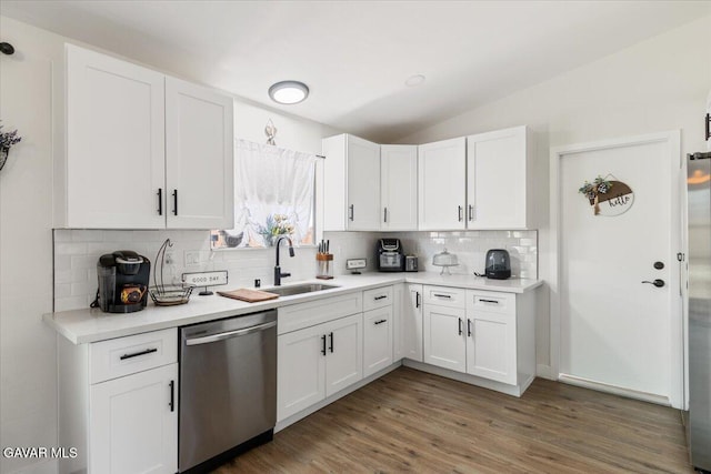 8649 Tamarack Ave, California City, CA 93505 - kitchen with dishwasher, tasteful backsplash, white cabinets, light wood-style floors, and light countertops