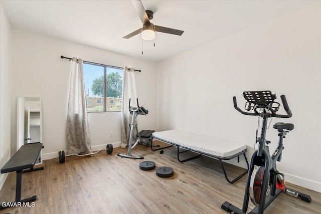 8649 Tamarack Ave, California City, CA 93505 - workout room with wood finished floors and a ceiling fan