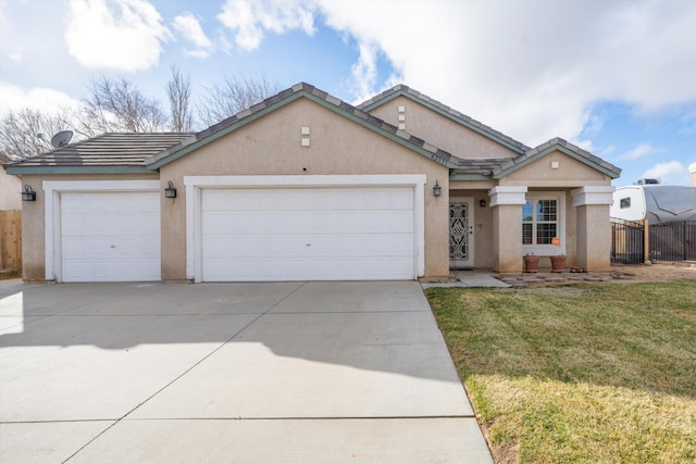 view of front of property with a garage and a front lawn