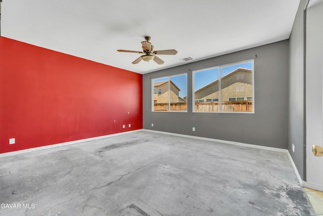 2407 Bavarian Ave, Rosamond, CA 93560 - empty room with unfinished concrete floors and a ceiling fan