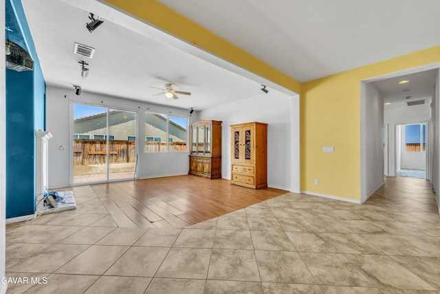 2407 Bavarian Ave, Rosamond, CA 93560 - unfurnished living room featuring a ceiling fan and tile patterned flooring