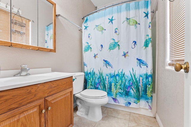 full bathroom with tile patterned flooring, vanity, toilet, and shower / tub combo with curtain