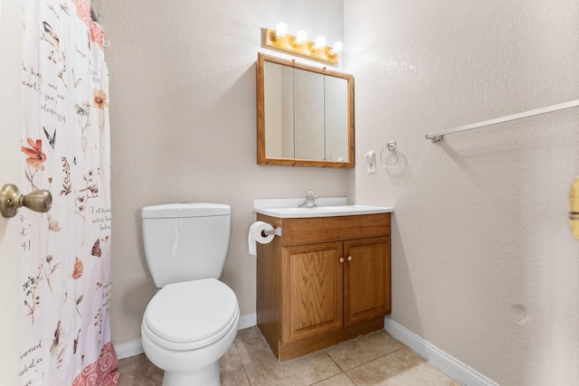 bathroom featuring tile patterned floors, vanity, curtained shower, and toilet