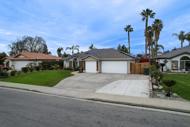 ranch-style house with a garage and a front yard