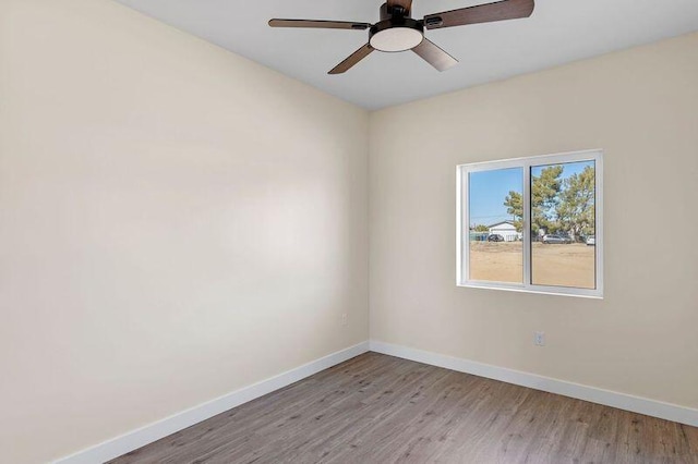 unfurnished room featuring ceiling fan and light hardwood / wood-style flooring