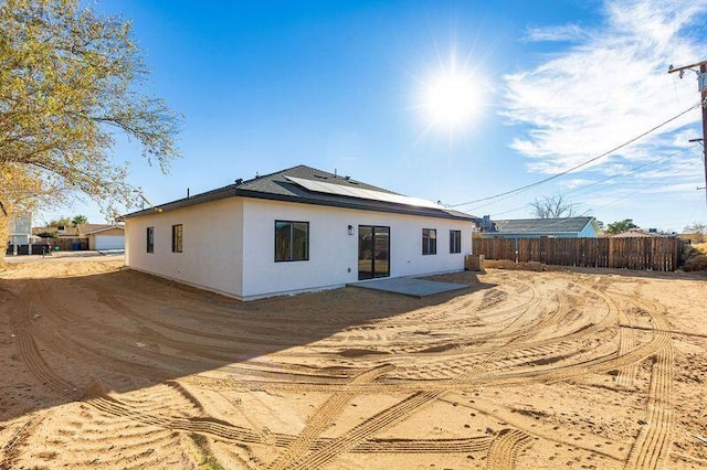 back of property with solar panels