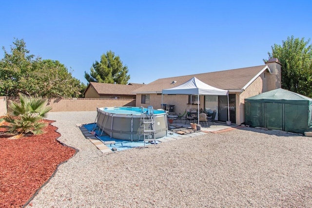 44605 Gillan Ave, Lancaster, CA 93535 - rear view of property featuring a fenced backyard and a patio