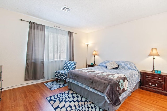 44605 Gillan Ave, Lancaster, CA 93535 - bedroom featuring light wood-style flooring and a textured ceiling