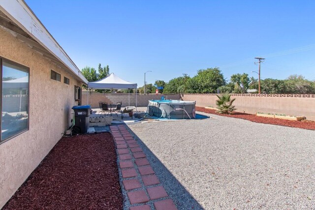 44605 Gillan Ave, Lancaster, CA 93535 - fenced backyard with a patio area