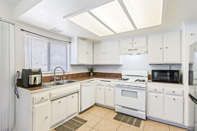 44605 Gillan Ave, Lancaster, CA 93535 - kitchen featuring white appliances, under cabinet range hood, and white cabinets