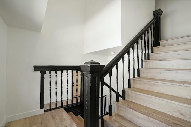 2745 Kenwood Ave, Los Angeles, CA 90007 - staircase with baseboards and wood finished floors