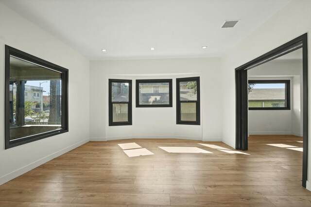 2745 Kenwood Ave, Los Angeles, CA 90007 - empty room featuring light wood finished floors, baseboards, and visible vents