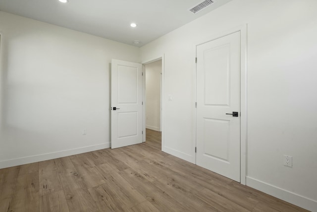 2745 Kenwood Ave, Los Angeles, CA 90007 - unfurnished bedroom featuring recessed lighting, baseboards, visible vents, and light wood finished floors