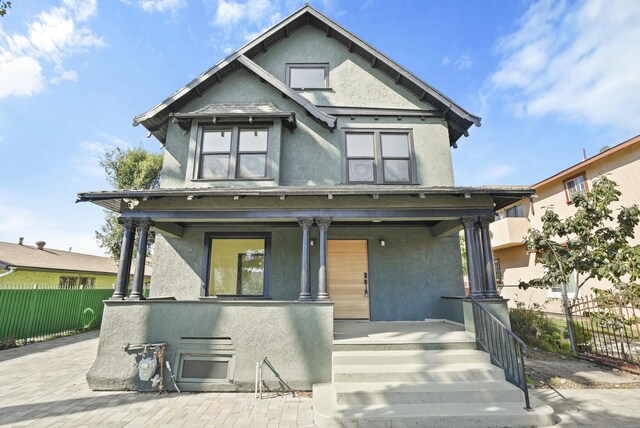 2745 Kenwood Ave, Los Angeles, CA 90007 - victorian house with covered porch, fence, and stucco siding