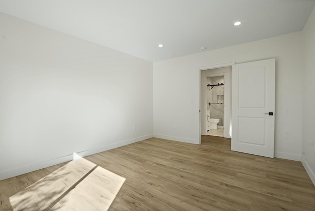 2745 Kenwood Ave, Los Angeles, CA 90007 - spare room with recessed lighting, baseboards, and wood finished floors