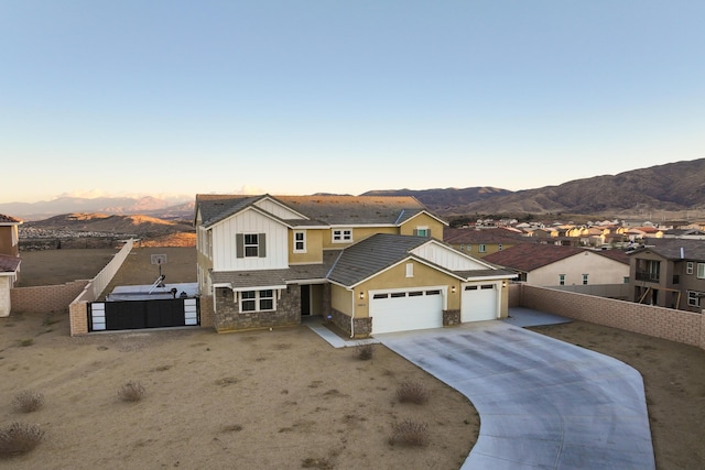 view of front of house with a mountain view and a garage