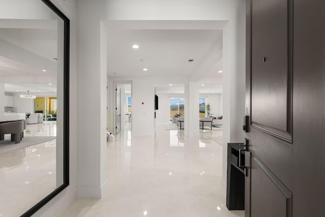 foyer with an inviting chandelier