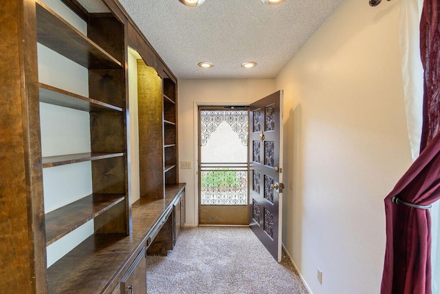 mudroom with a textured ceiling, recessed lighting, carpet, and baseboards