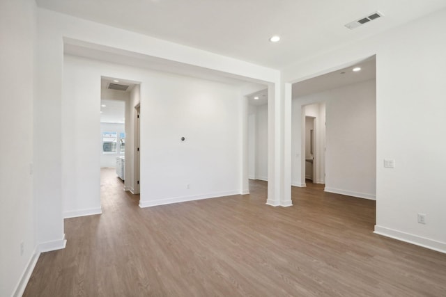 empty room with hardwood / wood-style floors