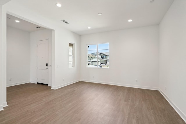 spare room featuring dark hardwood / wood-style floors