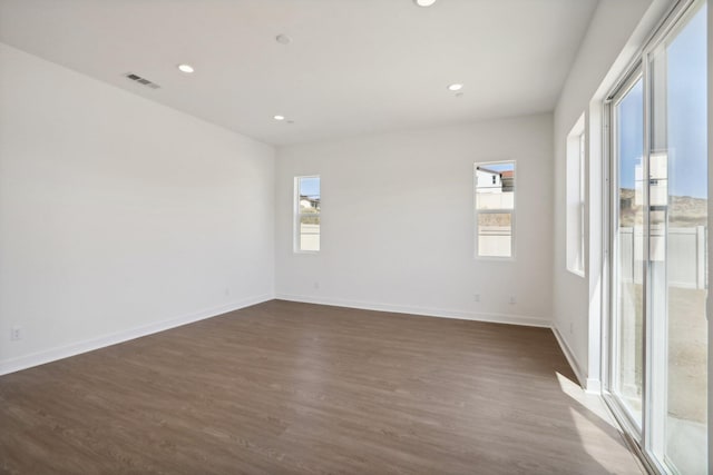 empty room featuring dark wood-type flooring