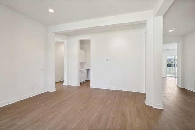 empty room with wood-type flooring