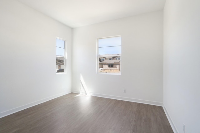 unfurnished room featuring dark hardwood / wood-style floors